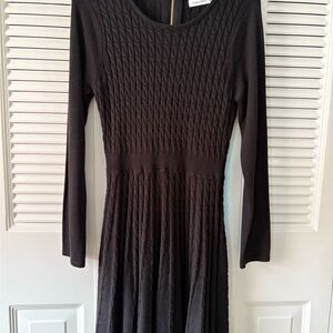 Never worn Calvin Klein black ribbed sweater dress with defined waist.